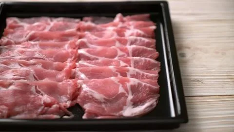 Raw beef steaks on a black tray ready for cooking Stock Photos