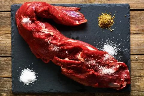 Raw beef tenderloin Raw beef tenderloin meat over slate Copyright: xZoonar... Stock Photos