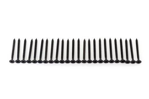 A raw of black average size screws on white background Stock Photos