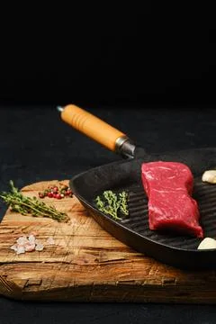 Raw boneless beef tri-tip steak on frying pan Stock Photos