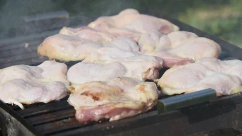 Raw boneless chicken drums on barbeque time lapse Stock Footage 335694535