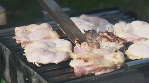Raw boneless chicken drums on barbeque time lapse Stock Footage 335694698