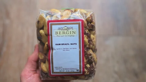Raw brazil nuts packaged by Bergin food brand sign on plastic bag Stock Footage 336782830