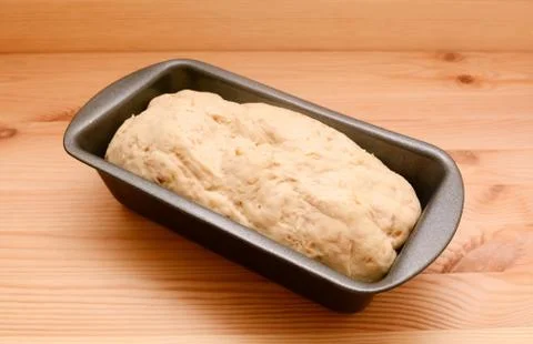 Raw bread dough in a 2 lb loaf tin Stock Photos