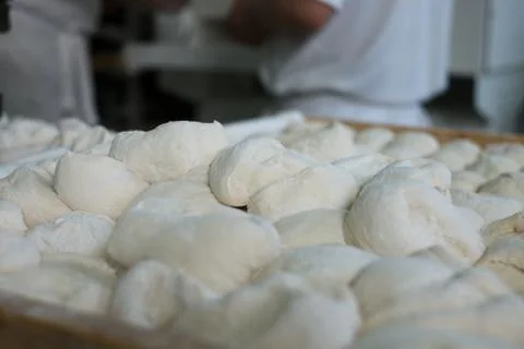 Raw Bread Dough in Front of Bakers Stock Photos