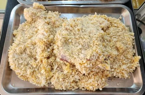 Raw Breaded Pork Cutlets in Panko Crumbs on Metal Tray for Deep Frying Stock Photos