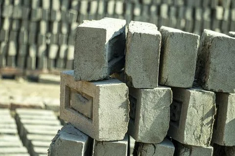 Raw bricks are made from clay and then they are fired in a fire Foto stock