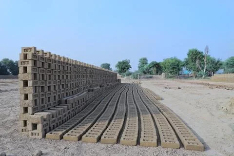 Raw bricks kept in a pattern at bricks factory Stock Photos
