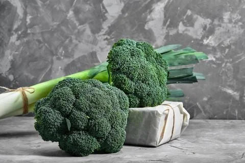 Raw broccoli on concrete background, close up. Healthy food Stock Photos
