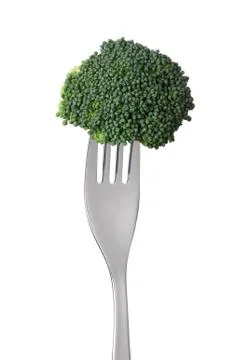 Raw broccoli on a fork Stock Photos
