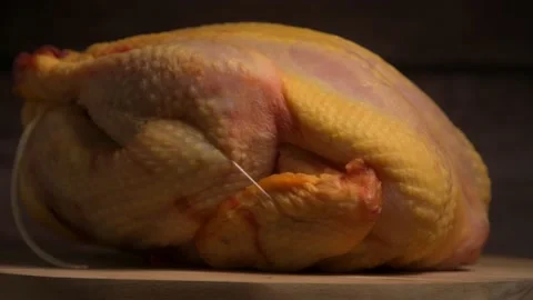 Raw broiler chicken meat on turntable, Fresh diet poultry meat on a brown Stock Footage 162157784
