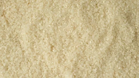 Raw broken rice groats texture background. Stock Footage 335436569