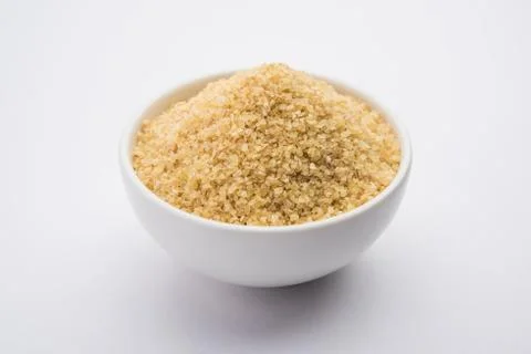 Raw Broken Wheat or Daliya or Dalia, selective focus Stock Photos