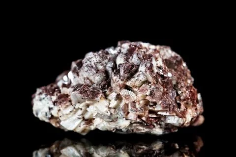 Raw brown calcite mineral stone in front of black background 스톡 사진