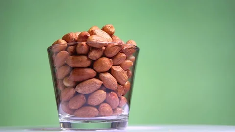 Raw brown nuts peanut rotates close-up macro Stock Footage 115052106