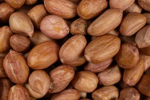 Raw brown peanuts macro view from above Fotos Stock