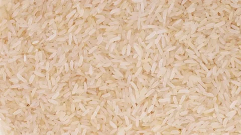 Raw brown rice close-up rotation slow mo Stock Footage 146705216