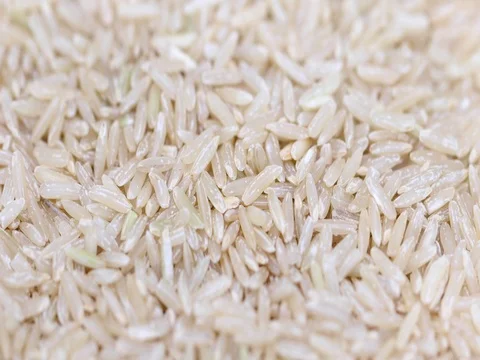 Raw Brown Rice, Rotating Macro Shot Stock Footage 74943280