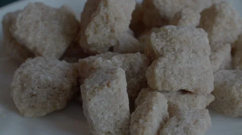 Raw Brown sugar from sugar cane, rotating Stock Footage 68035306