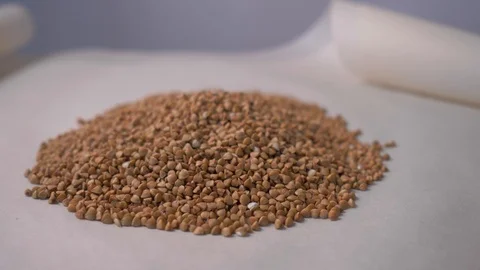 Raw buckwheat is on the table. Concept: footage for the recipe. 4K. Food video Stock Footage 105877680