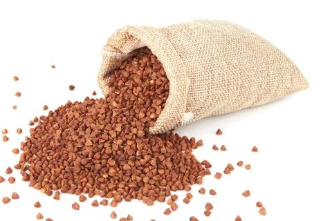 Raw buckwheat on white Stock Photos