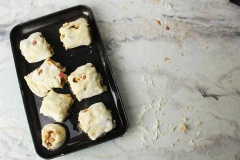 Raw buns on a black baking sheet top view place for eksta copyspace Stock Photos