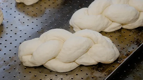 Raw buns on the tray. Process of baking breads. Stock Footage 108632997