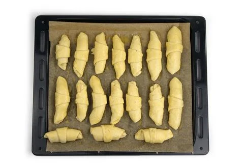 Raw cake on the baking pan Stock Photos