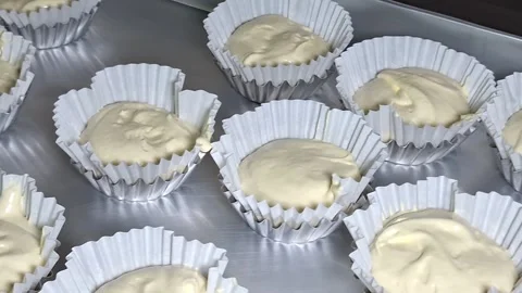 Raw Cake Batter in Paper Cups on Baking Tray Ready for Oven 스톡 동영상 347881853