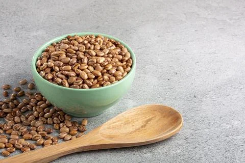 Raw carioca beans on the table. Stock Photos