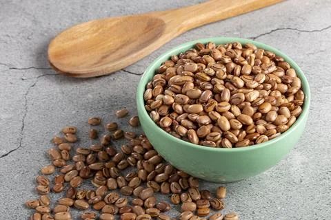 Raw carioca beans on the table. Stock Photos