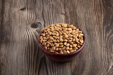 Raw carioca beans on the table. Stock Photos