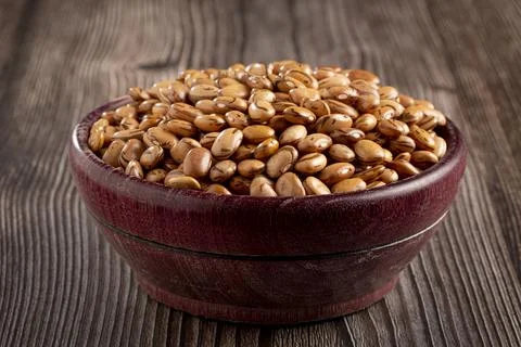 Raw carioca beans on the table. Stock Photos