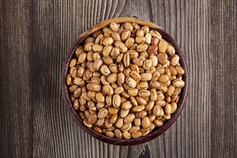 Raw carioca beans on the table. Stock Photos