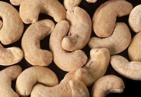 Raw Cashew Nuts on Black background Stock Photos