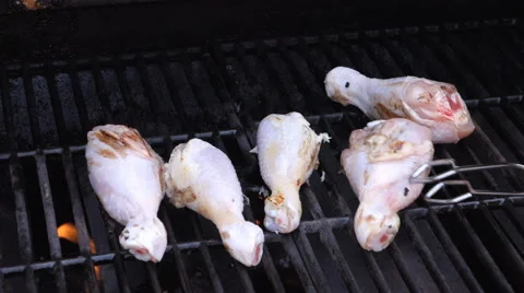Raw chicken on the bbq Stock Footage 51666607