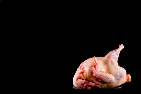 Raw chicken on a black background. Space for text menu Fotos Stock