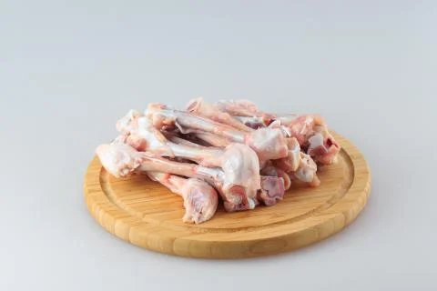 Raw chicken bones on a white background Stock Photos