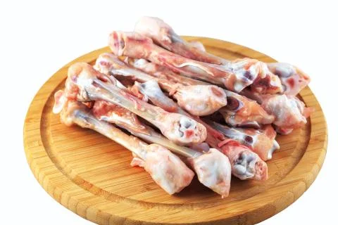 Raw chicken bones on a white background Stock Photos