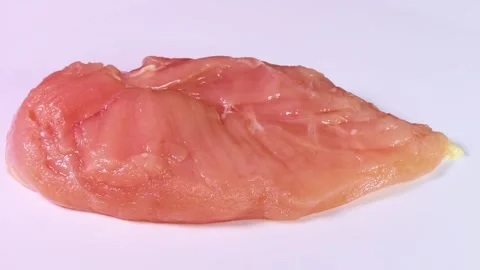 Raw chicken breast close up, rotating Stock Footage 307076287