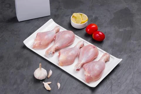 Raw chicken drum stick Stock Photos