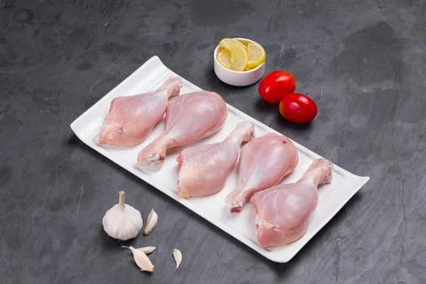 Raw chicken drum stick Stock Photos