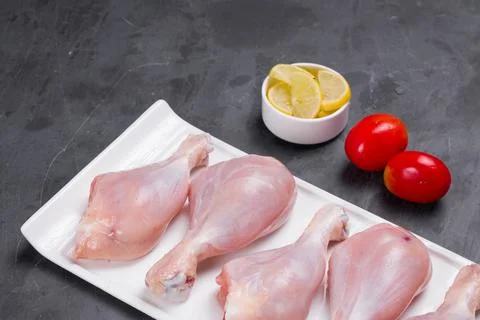 Raw chicken drum stick Stock Photos