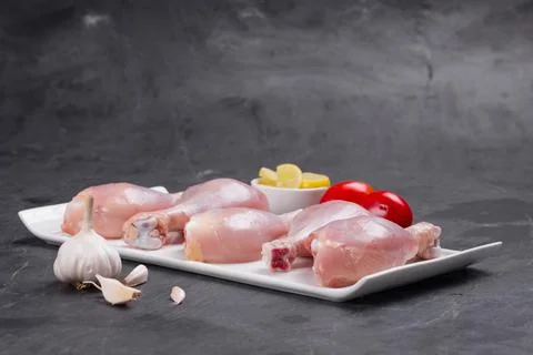 Raw chicken drum stick Stock Photos