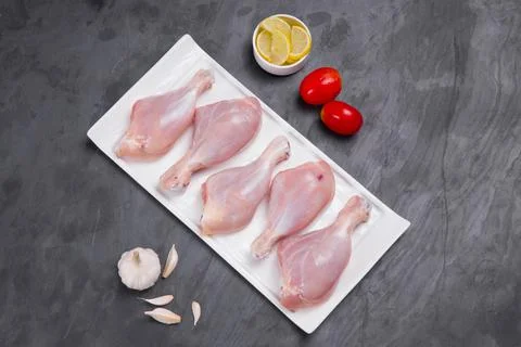 Raw chicken drum stick Stock Photos
