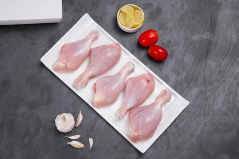 Raw chicken drum stick Stock Photos