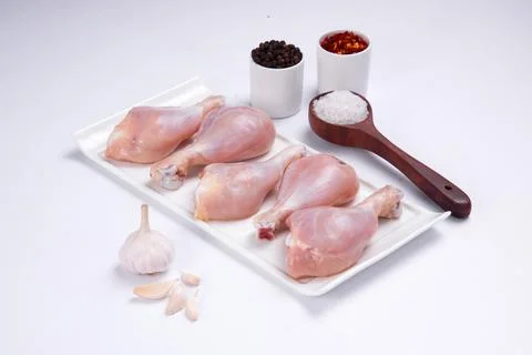 Raw chicken drum stick Stock Photos