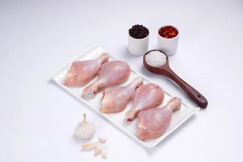 Raw chicken drum stick Stock Photos