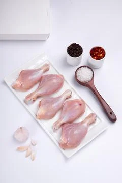 Raw chicken drum stick Stock Photos