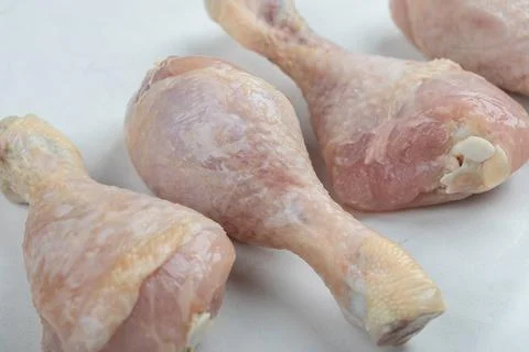 Raw Chicken drumstick on white background Stock Photos